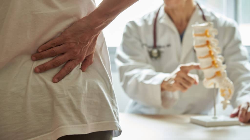 a doctor consulting a paitent on spinal cord stimulation